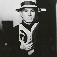 portrait of Andy Warhol with a novel