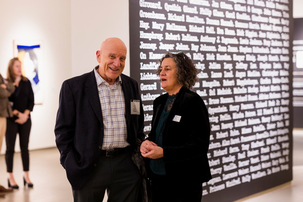 two people talking in the norman fisher collection