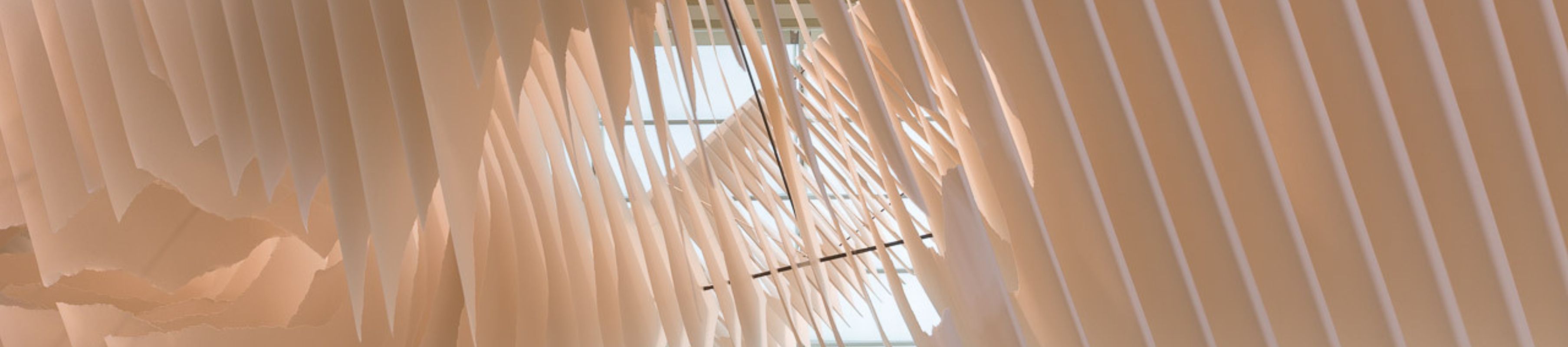 detail of Project Atrium: Angela Glajcar, which featured sheets of natural paper hanging from the ceiling