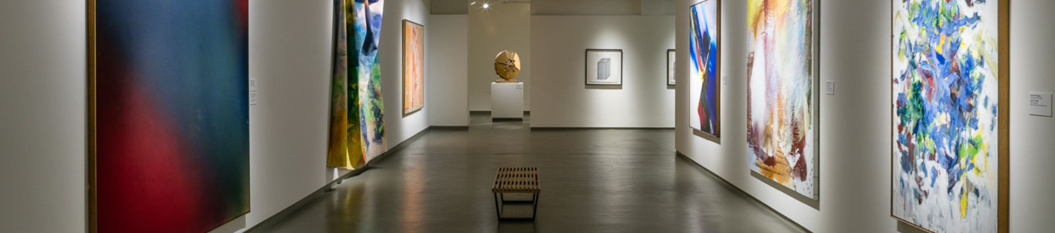 the MOCA permanent collection gallery with several paintings and a sculpture