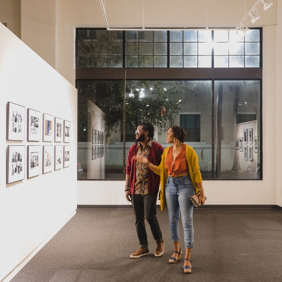couple looking at gallery wall during Museum Nights at MOCA