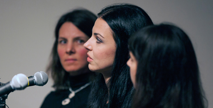 three women with microphones
