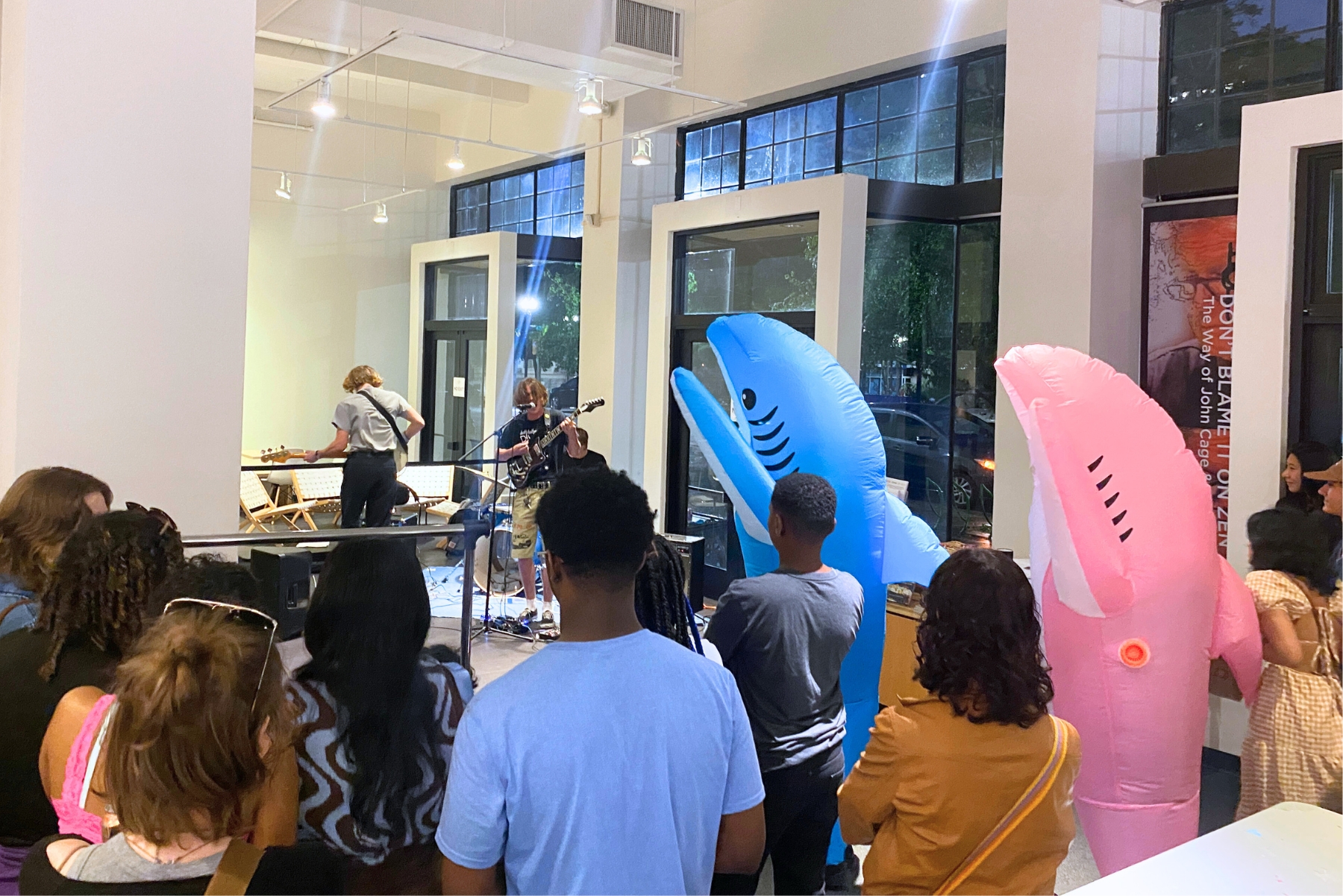 Teens and inflatable sharks at an event at MOCA
