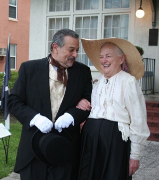 Photographs by Eric Cravey. two actors standing outside laughing