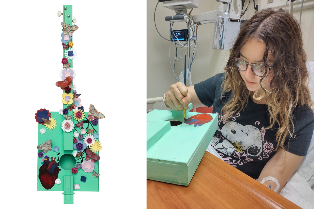 Art with a Heart patient Evie with her work