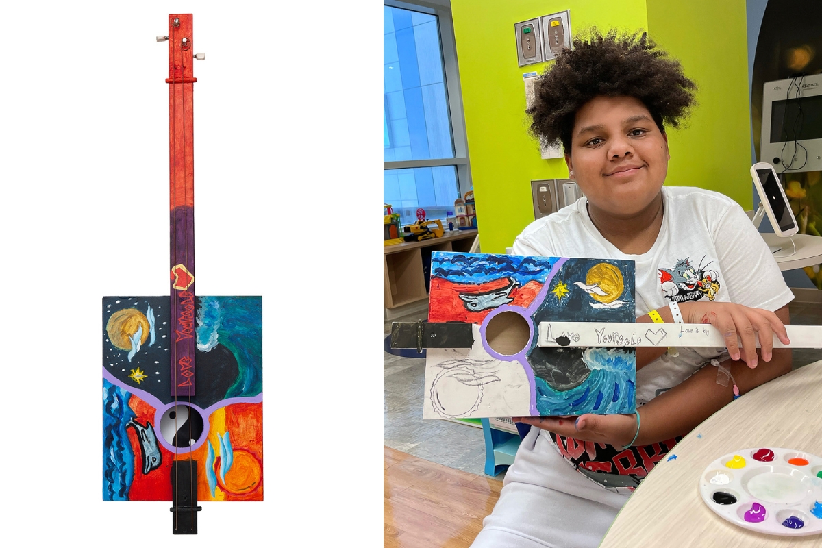 Art with a Heart patient Romeo with his work 