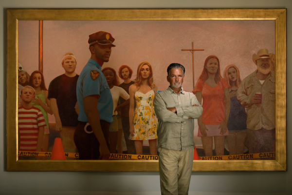 portrait of artist Bo Bartlett standing in front of one of his large scale paintings