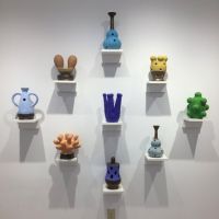eight colorful ceramic sculptures