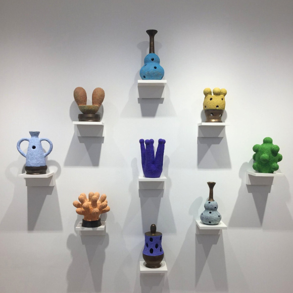 eight colorful ceramic sculptures