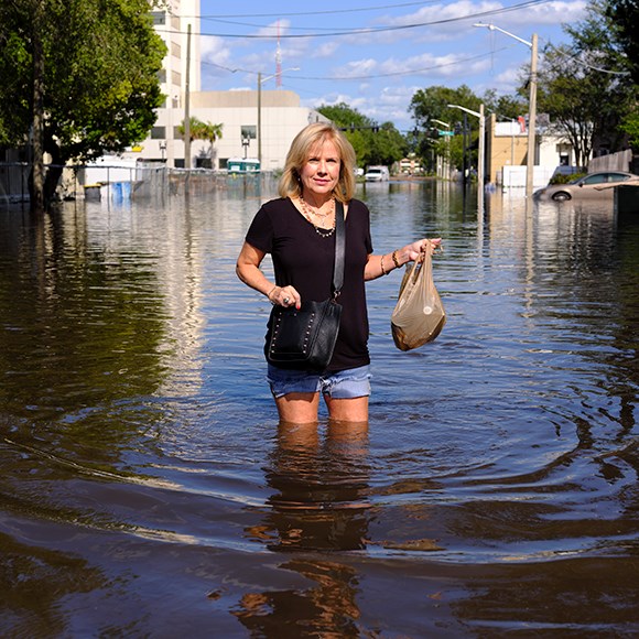 a woman standing in thigh-deep water