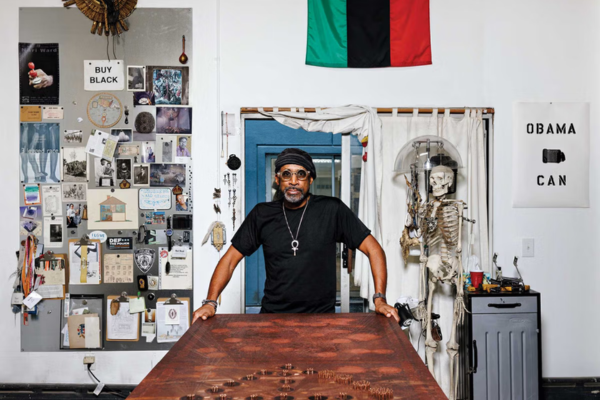 Portrait of artist Nari Ward in studio