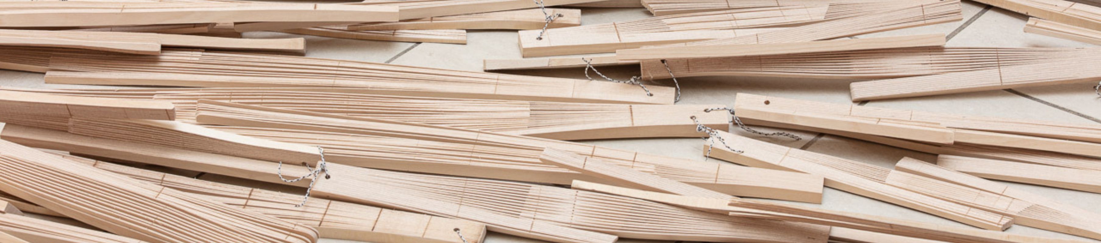 detail of Project Atrium: Muad Cotter, which featured small sheets of wood held together in bundles with string