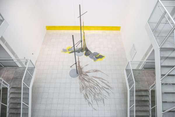artwork Maud Cotter featuring two tall structures with organic material at their bases