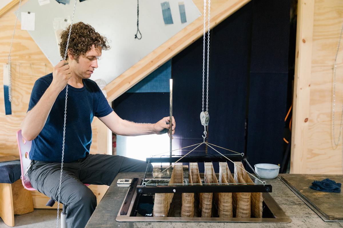 artist Rowland Ricketts working in his textile studio