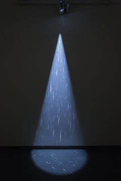 spotlight casting rain on the wall and floor