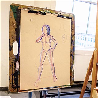 figure drawing on paper and easel