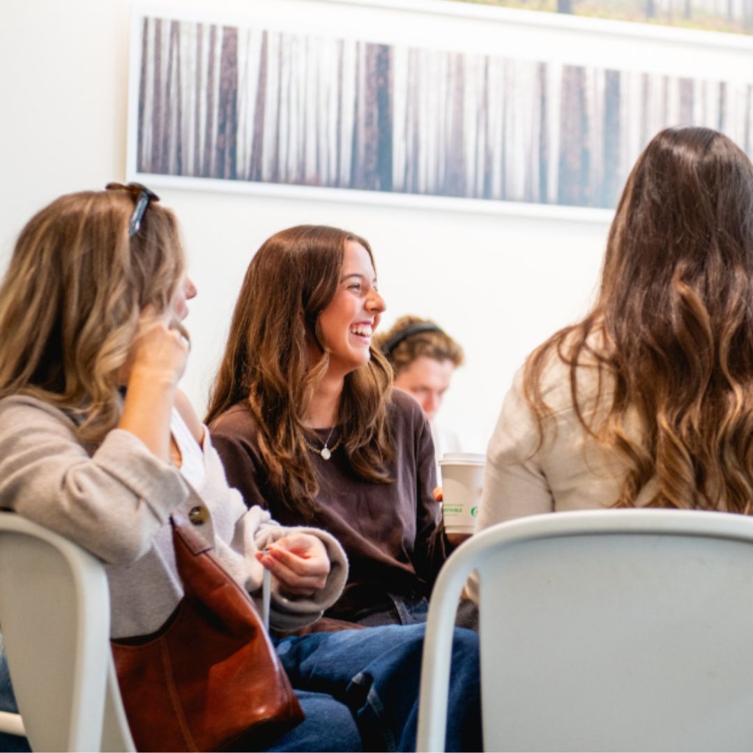 people laughing and enjoying drinks in Setlan Coffee