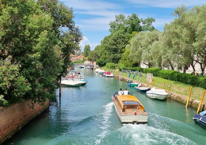 View of canal in Giardini with boats