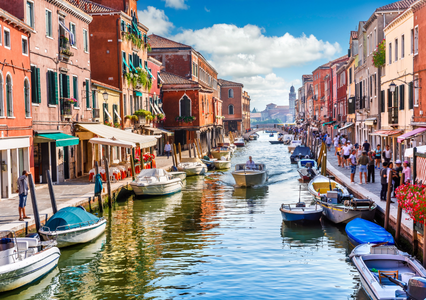 Image of building lined canal in Murano Italy with boats