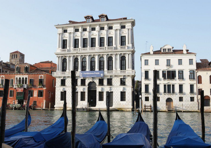 Exterior of Fondazione Prada on canal with blue gondolas