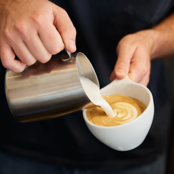 close up of someone pouring an espresso
