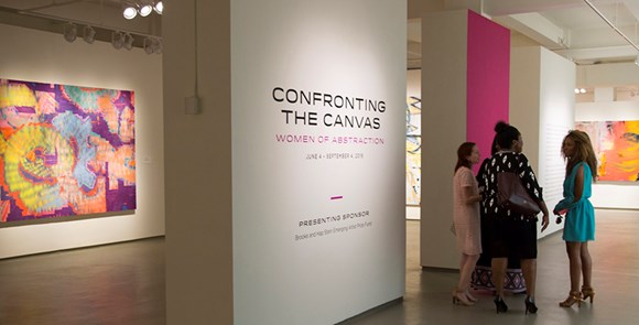 visitors gather at the entrance to Confronting the Canvas